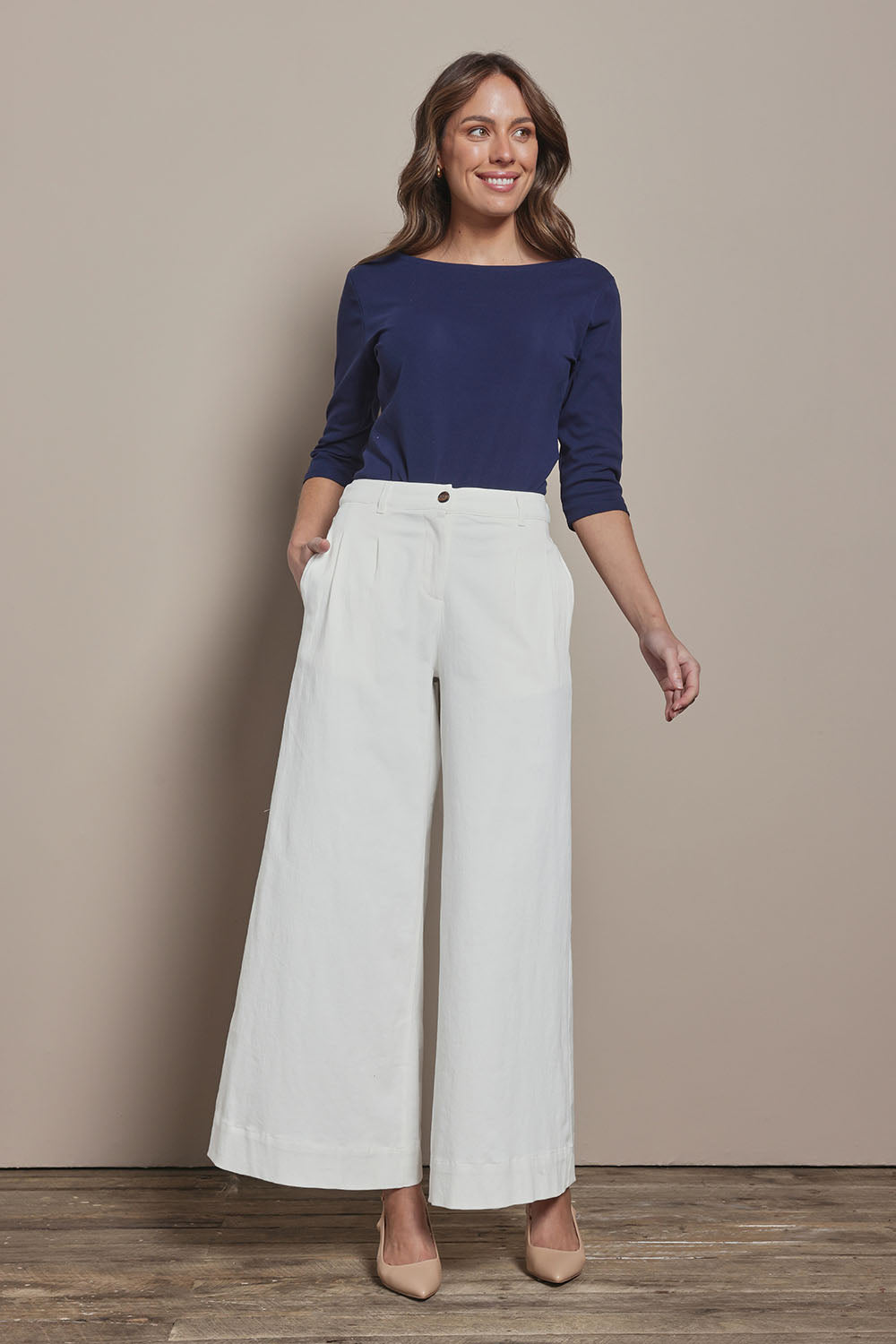 Model Madeline wearing size 10 of The Reversible Cotton Stretch Top in colour Navy (Blue), from the front, showing the whole outfit