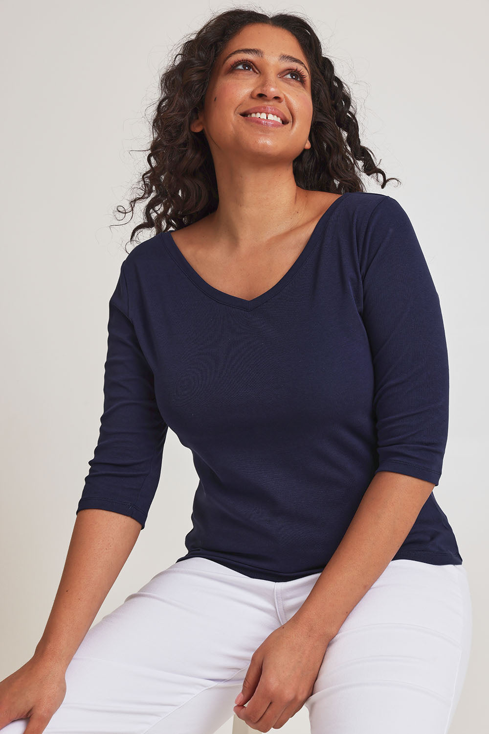 Model Terri-Leigh wearing size 10 of The Reversible Cotton Stretch Top in colour Navy (Blue), from the front, cropped image