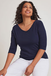Model Terri-Leigh wearing size 10 of The Reversible Cotton Stretch Top in colour Navy (Blue), from the front, cropped image