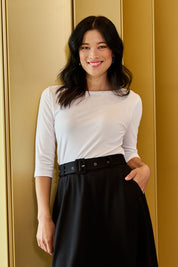 Model Miranda wearing size 10 of The Reversible Cotton Jersey Top in colour White (White), from the front, showing the whole outfit