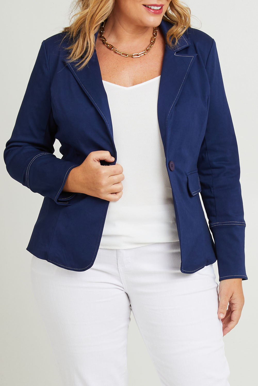 Model Fiona wearing size 16 of The Contrast Stitching Stretch Blazer in colour Navy (Blue), from the front, cropped image