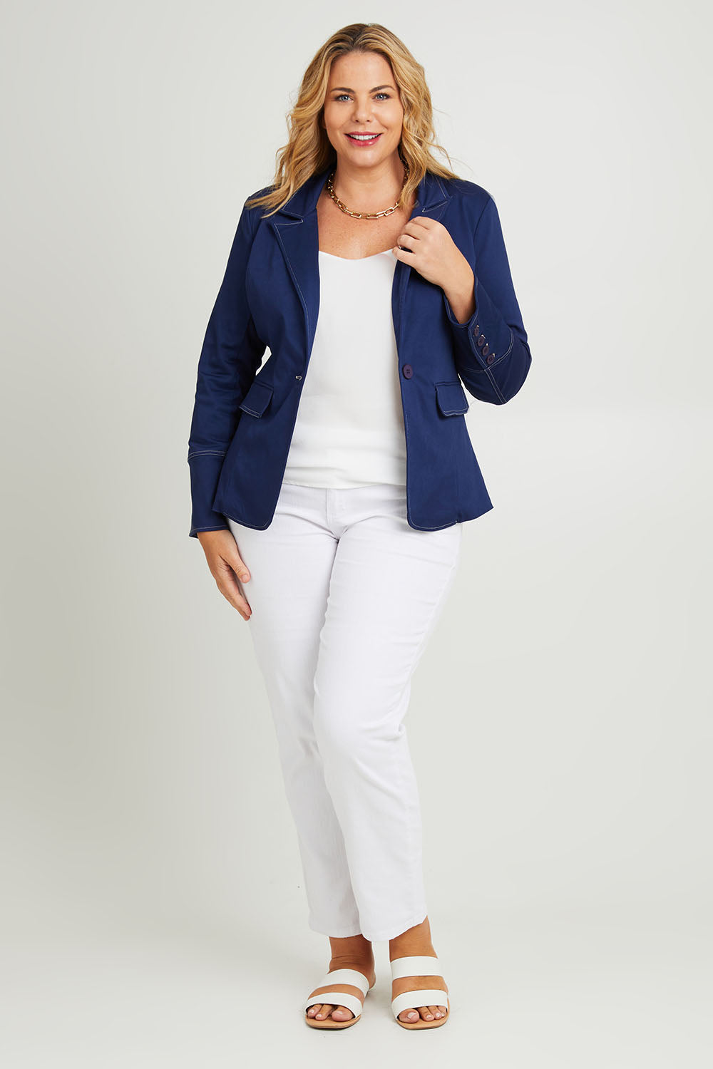 Model Fiona wearing size 16 of The Contrast Stitching Stretch Blazer in colour Navy (Blue), from the front, showing the whole outfit