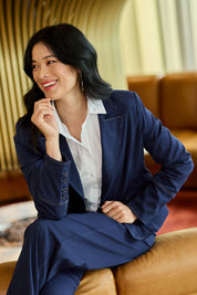 Model Miranda wearing size 10 of The Contrast Stitching Stretch Blazer in colour Navy (Blue), from the front, showing the whole outfit