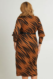 Model Fiona wearing size 16 of The Printed Knit Dress With Belt in colour Abstract (Black), from the back