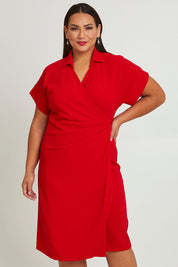 Model Ashleigh wearing size 16 of The Kimono Sleeve Collar Wrap Dress in colour Red (Red), from the front, cropped image