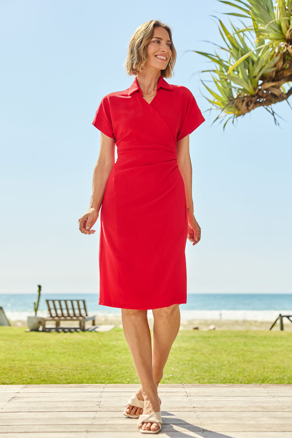 Model Riina wearing size 10 of The Kimono Sleeve Collar Wrap Dress in colour Red (Red), from the front, showing the whole outfit