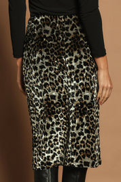 Model Madeline wearing size 10 of The Printed Velvet Pull On Skirt in colour Leopard (Black), from the back