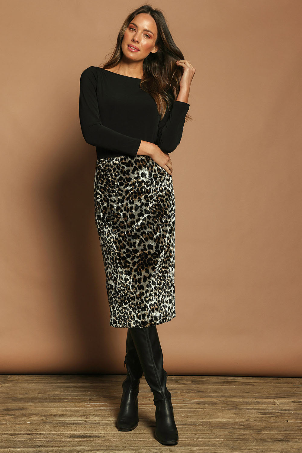 Model Madeline wearing size 10 of The Printed Velvet Pull On Skirt in colour Leopard (Black), from the front, showing the whole outfit