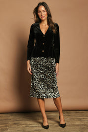 Model Madeline wearing size 10 of The Printed Velvet Pull On Skirt in colour Leopard (Black), from the front, showing the whole outfit