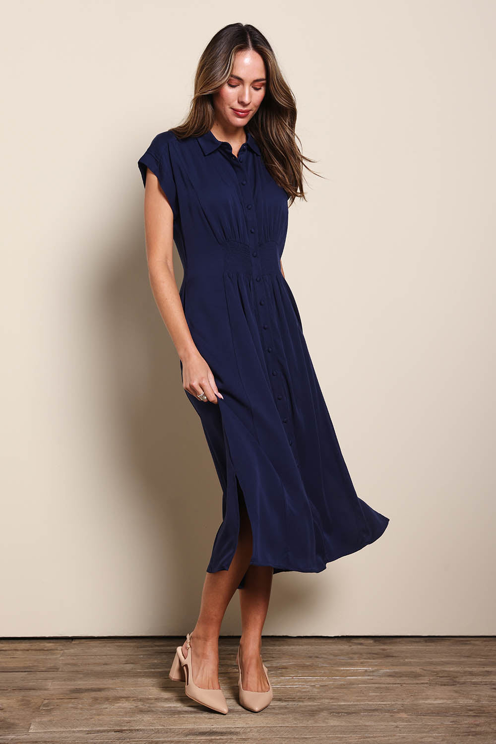 Model Madelinec wearing size 10 of the The Shirred Waist Detail Dress - Navyblue in colour Navyblue, from the front