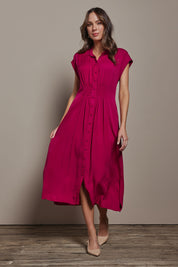 Model Madeline wearing size 10 of The Shirred Waist Detail Dress in colour Raspberry (Red), from the front, showing the whole outfit