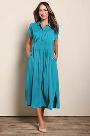 Model Madelinec wearing size 10 of the The Shirred Waist Detail Dress - Teal in colour Teal, from the front