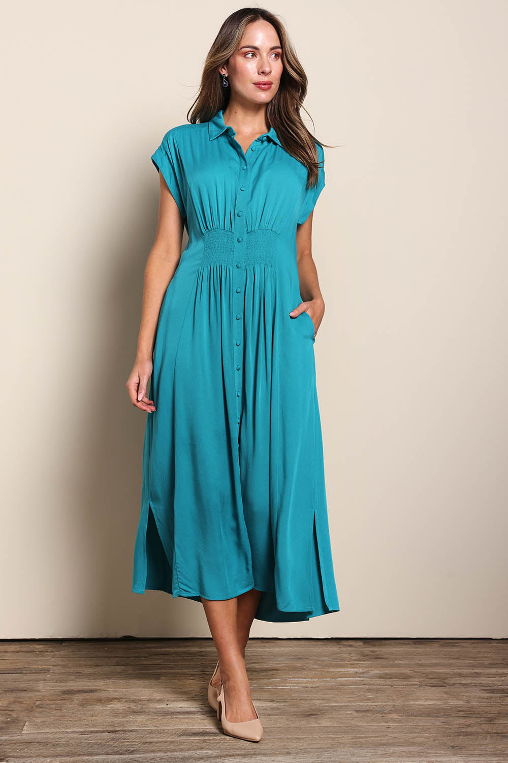 Model Madelinec wearing size 10 of the The Shirred Waist Detail Dress - Teal in colour Teal, from the front