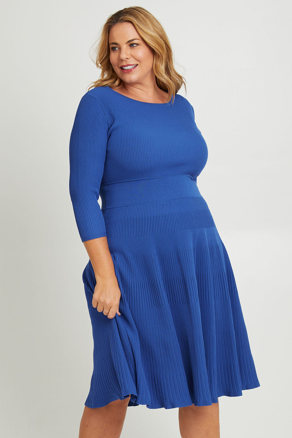 Model Fiona wearing size XL of The 3/4 Sleeve Reversible Knit Dress in colour Royalazure (Blue), from the front, cropped image