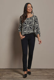 Model Amanda wearing size 10 of The High Rise Pull On Ponte Pant in colour Black (Black), from the front, showing the whole outfit