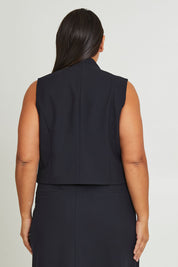 Model Ashleigh wearing size 16 of The Tailored Vest in colour Ink (Blue), from the back