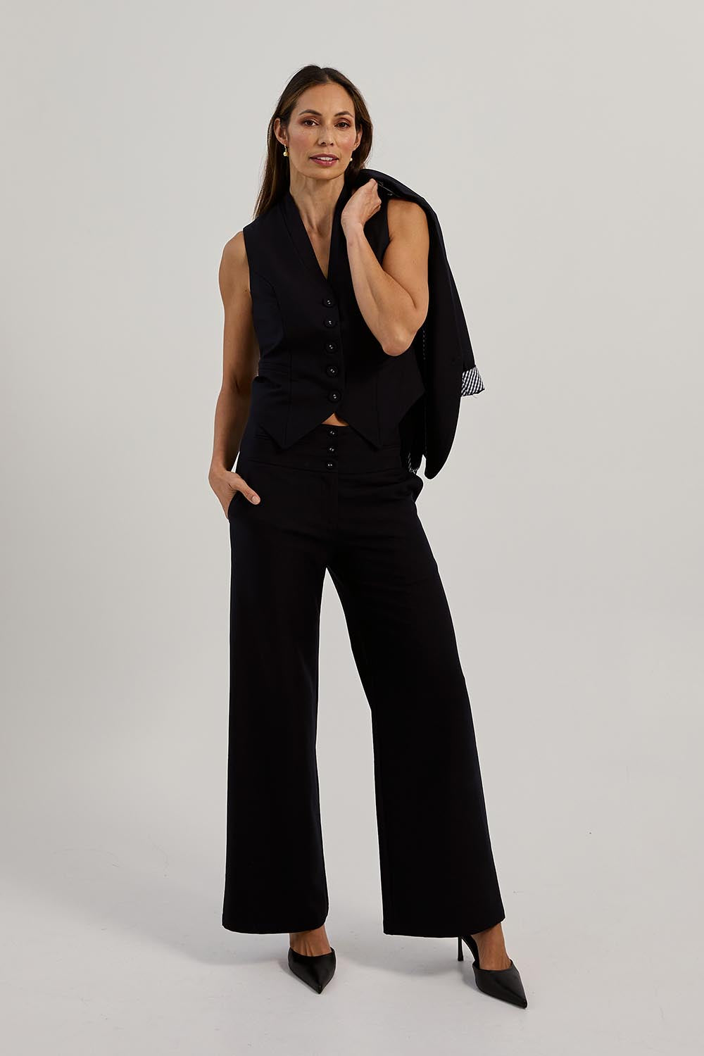 Model Amanda wearing size 10 of The Tailored Pant in colour Ink (Blue), from the front, showing the whole outfit