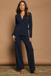 Model Madeline wearing size S of The Milano Knit Pull On Pant in colour Darknavy (Blue), from the front, showing the whole outfit