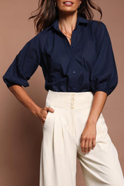 Model Amanda wearing size 10 of The Cotton Blouson Sleeve Shirt in colour Navy (Blue), from the front, cropped image