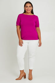 Model Ashleigh wearing size 16 of The 7/8 Cotton Stretch Pull On Pant in colour Snow (White), from the front, showing the whole outfit