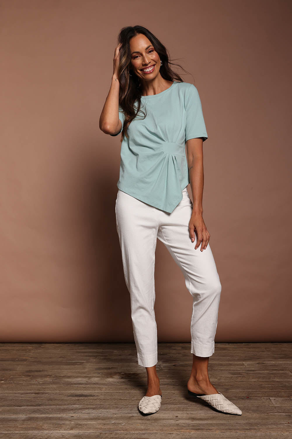 Model Amanda wearing size 10 of The Cotton Stretch Waist Detail Top in colour Duckegg (Blue), from the front, showing the whole outfit