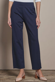 Model Madeline wearing size 10 of The Straight Cut Pull On Ponte Pant in colour Darknavy (Blue), from the front, cropped image