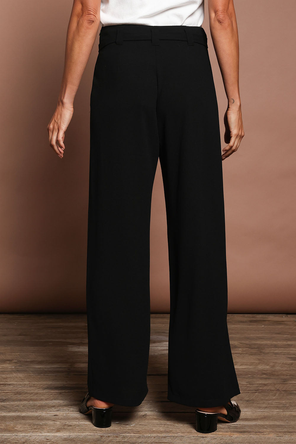 Model Amanda wearing size 10 of The Palazzo Pant in colour Black (Black), from the back