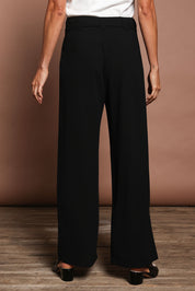 Model Amanda wearing size 10 of The Palazzo Pant in colour Black (Black), from the back