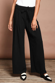 Model Amanda wearing size 10 of The Palazzo Pant in colour Black (Black), from the front, cropped image