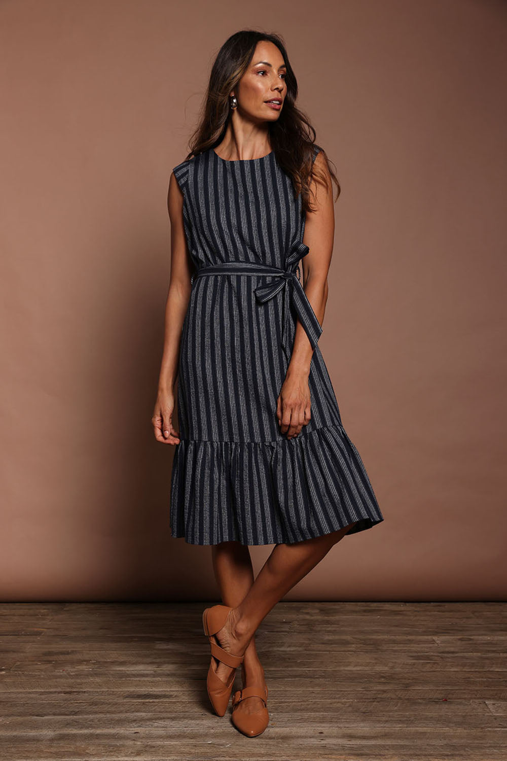 Model Amanda wearing size 10 of The Stripe Cotton Cap Sleeve Dress in colour Navy (Blue), from the front, showing the whole outfit