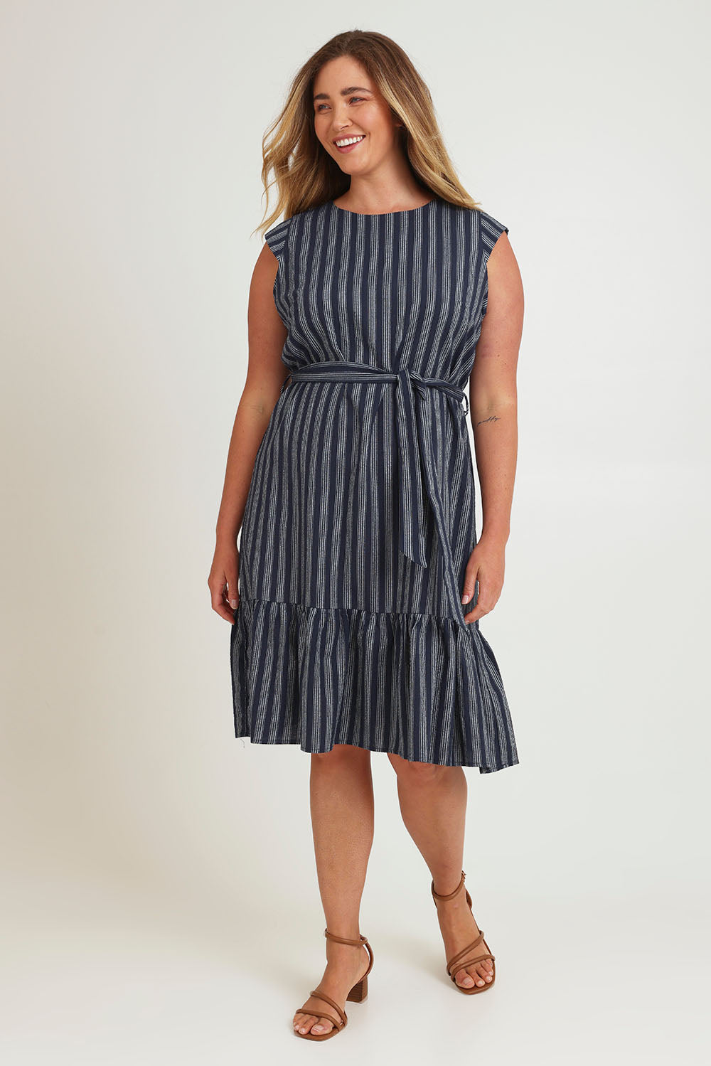 Model Chanel wearing size 16 of The Stripe Cotton Cap Sleeve Dress in colour Navy (Blue), from the front, showing the whole outfit