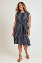 Model Chanel wearing size 16 of The Stripe Cotton Cap Sleeve Dress in colour Navy (Blue), from the front, showing the whole outfit