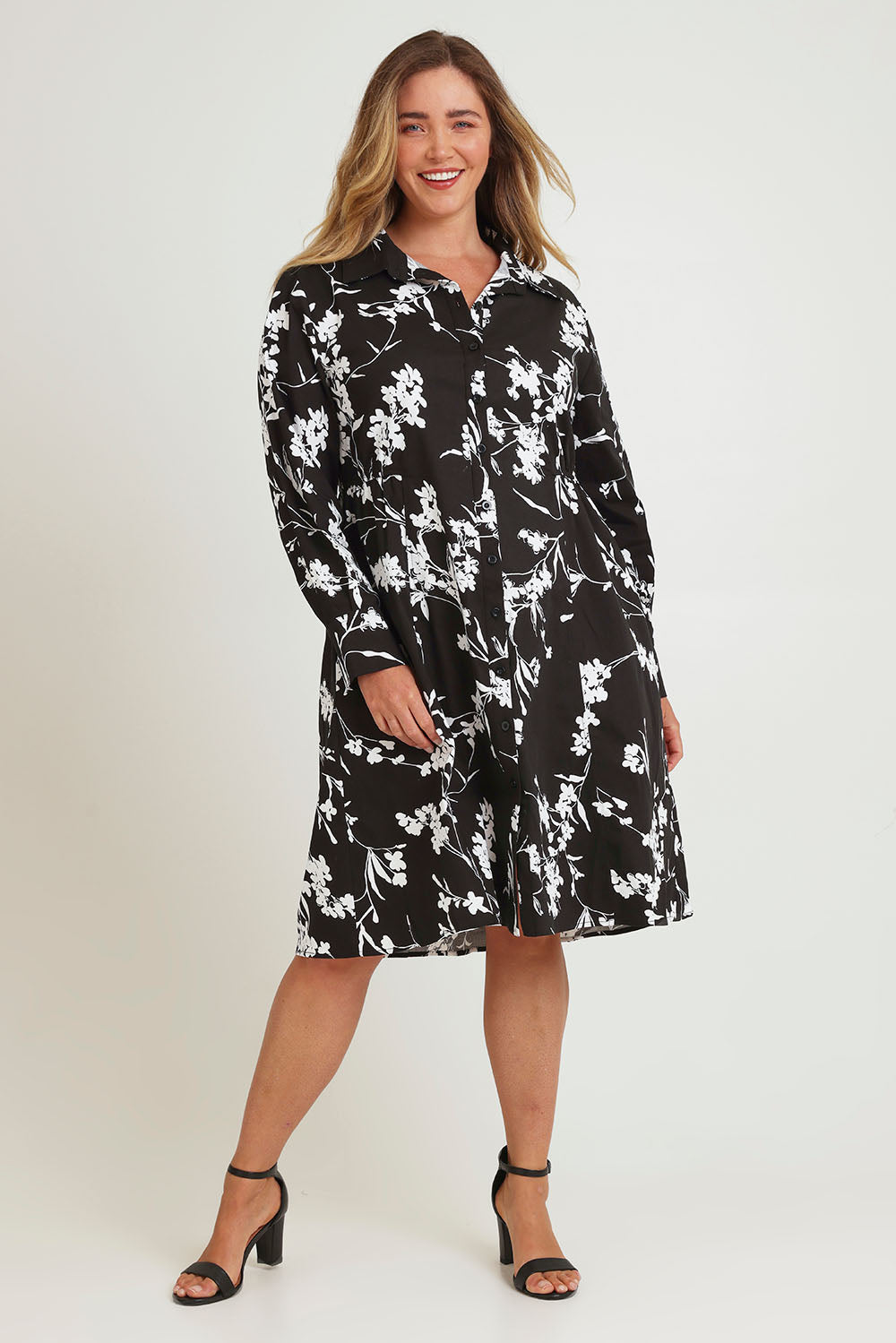 Model Chanel wearing size 16 of The Printed Cotton Stretch Shirt Dress in colour Blackfleur (Black), from the front, showing the whole outfit