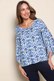 Model Madelinec wearing size 10 of the The Printed Bishop Sleeve Blouse – Bluedamask in colour Bluedamask, from an angle