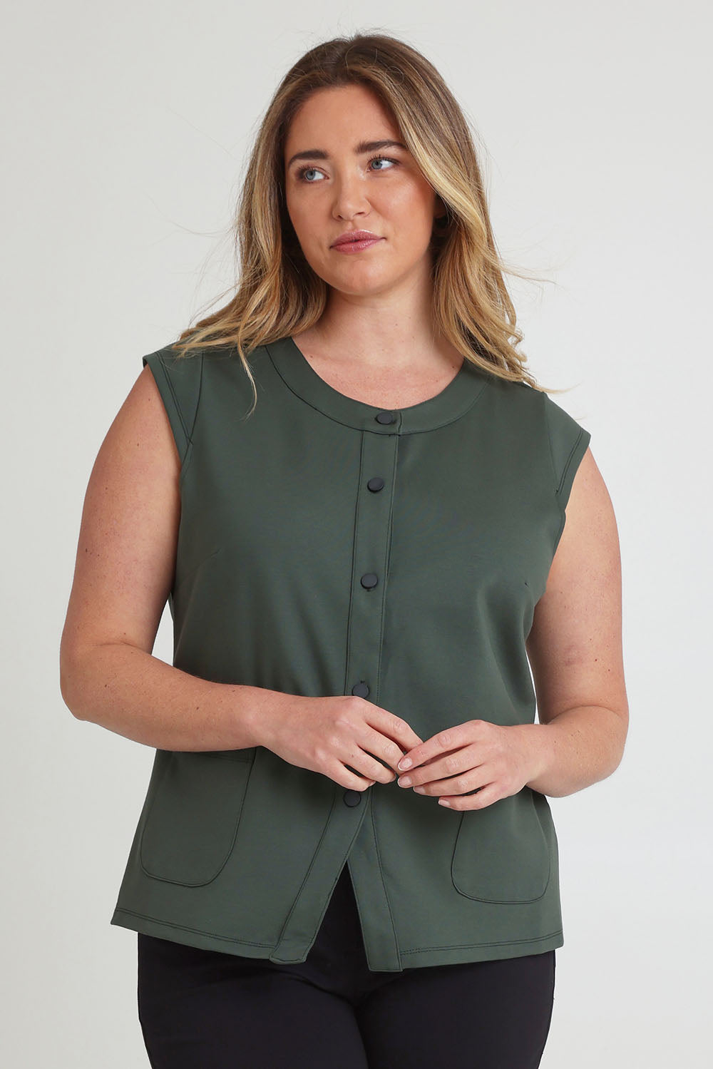 Model Chanel wearing size 16 of The Ponte Button Through Top in colour Forrest (Green), from the front, cropped image