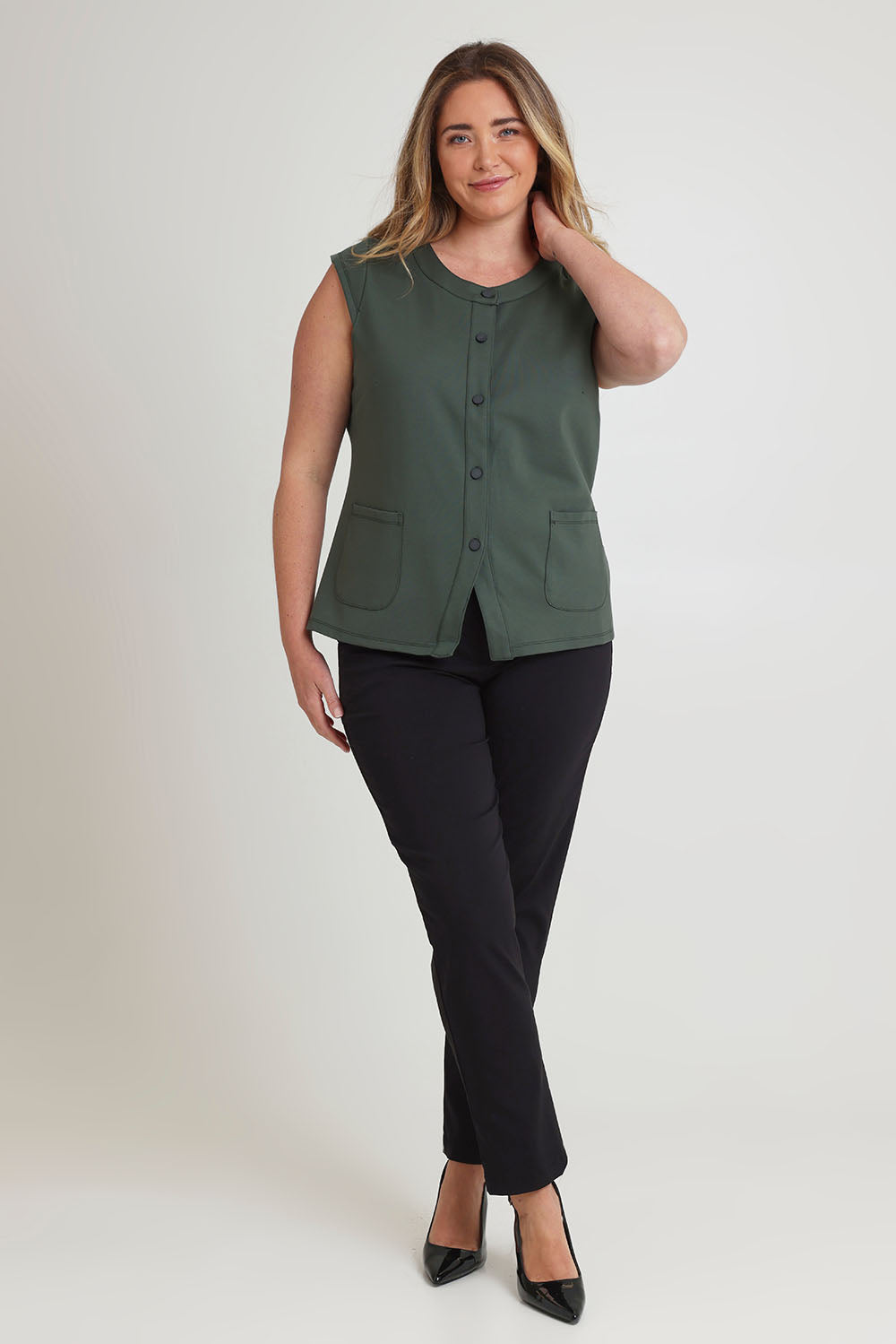Model Chanel wearing size 16 of The Ponte Button Through Top in colour Forrest (Green), from the front, showing the whole outfit