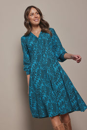 Model Madeline wearing size 10 of The Printed Cotton Button Through Dress in colour Tealbamboo (Blue), from the front, cropped image