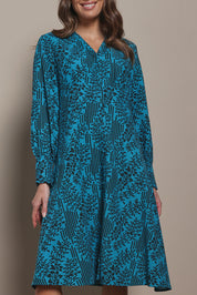 Model Madeline wearing size 10 of The Printed Cotton Button Through Dress in colour Tealbamboo (Blue), from the front, cropped image