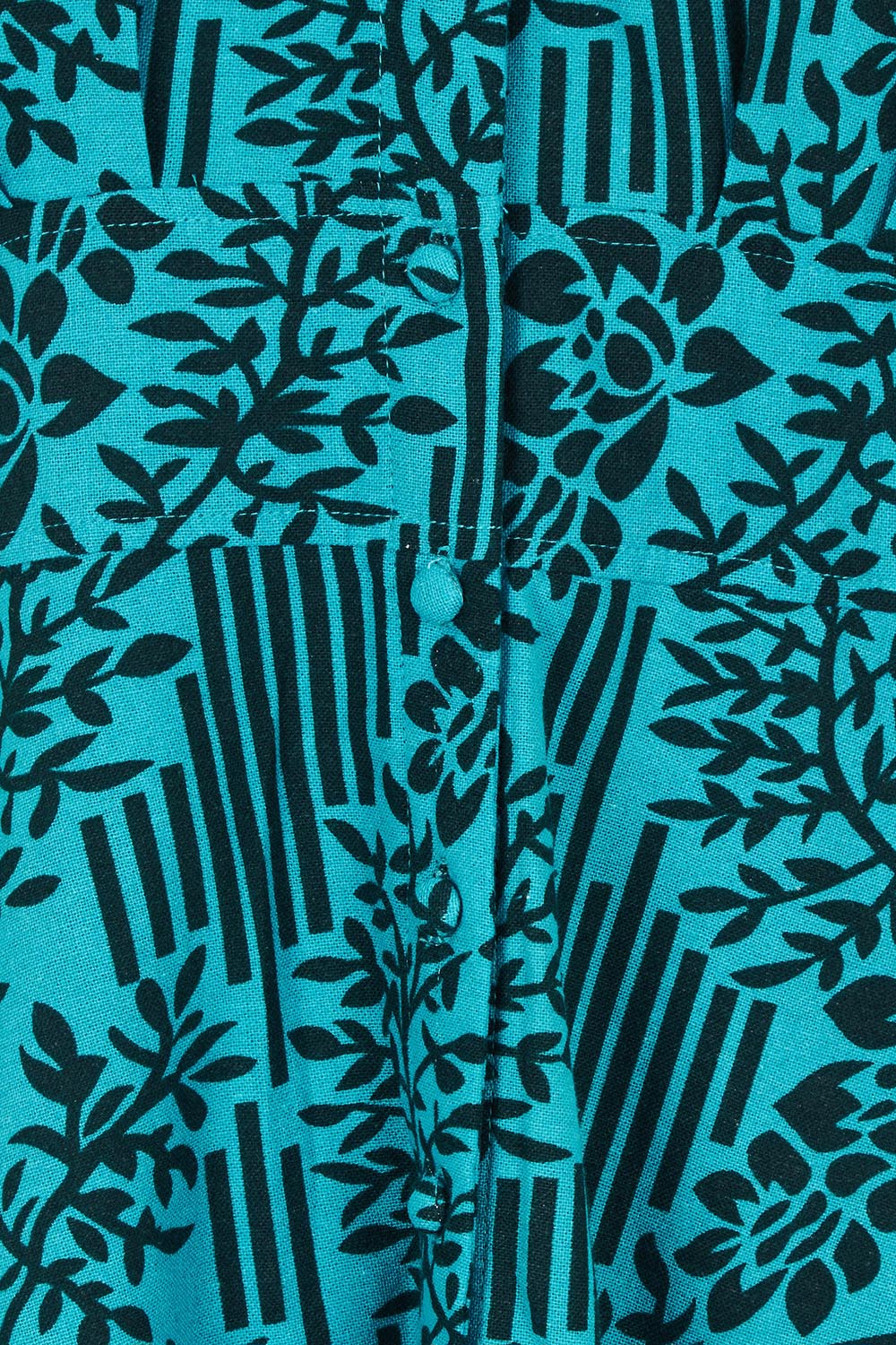 Product shot of The Printed Cotton Button Through Dress in colour Tealbamboo (Blue), detail
