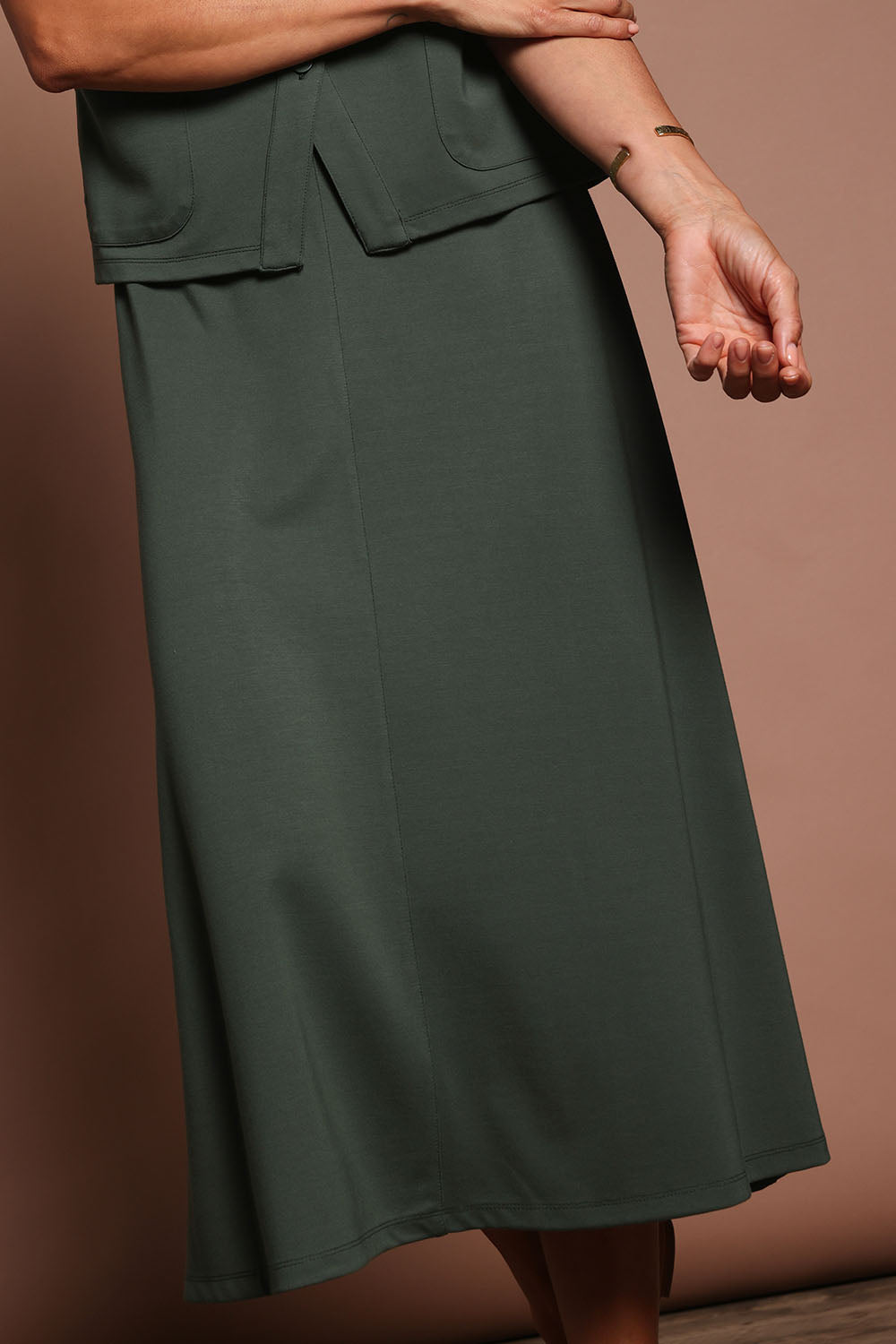 Model Amanda wearing size 10 of The Ponte A Line Pull On Skirt in colour Forrest (Green), from the front, cropped image