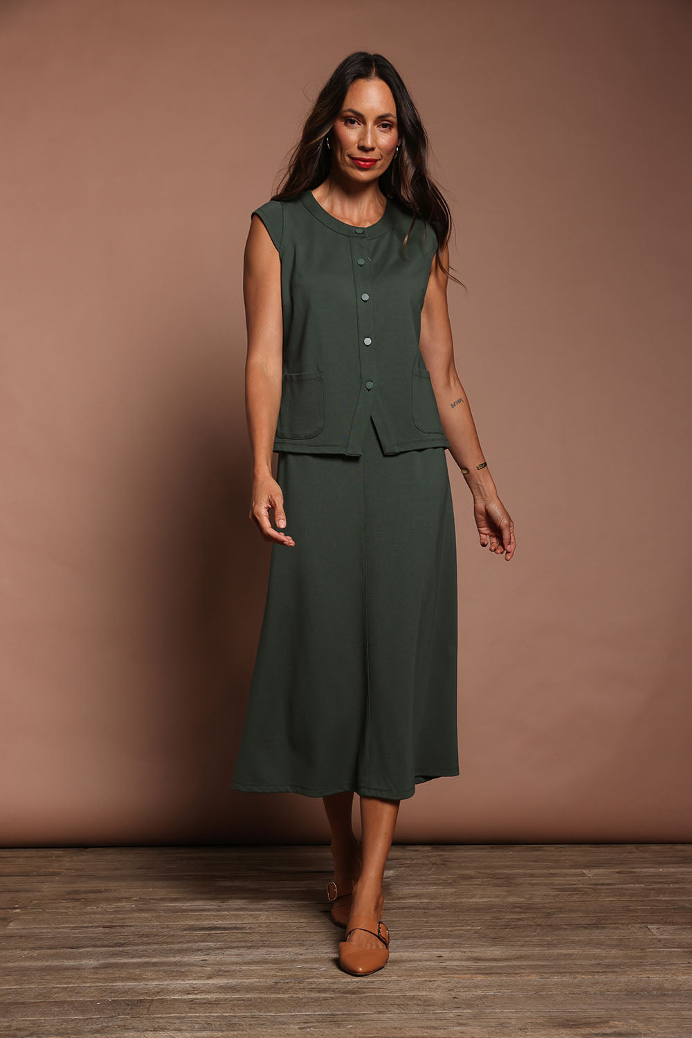 Model Amanda wearing size 10 of The Ponte A Line Pull On Skirt in colour Forrest (Green), from the front, showing the whole outfit