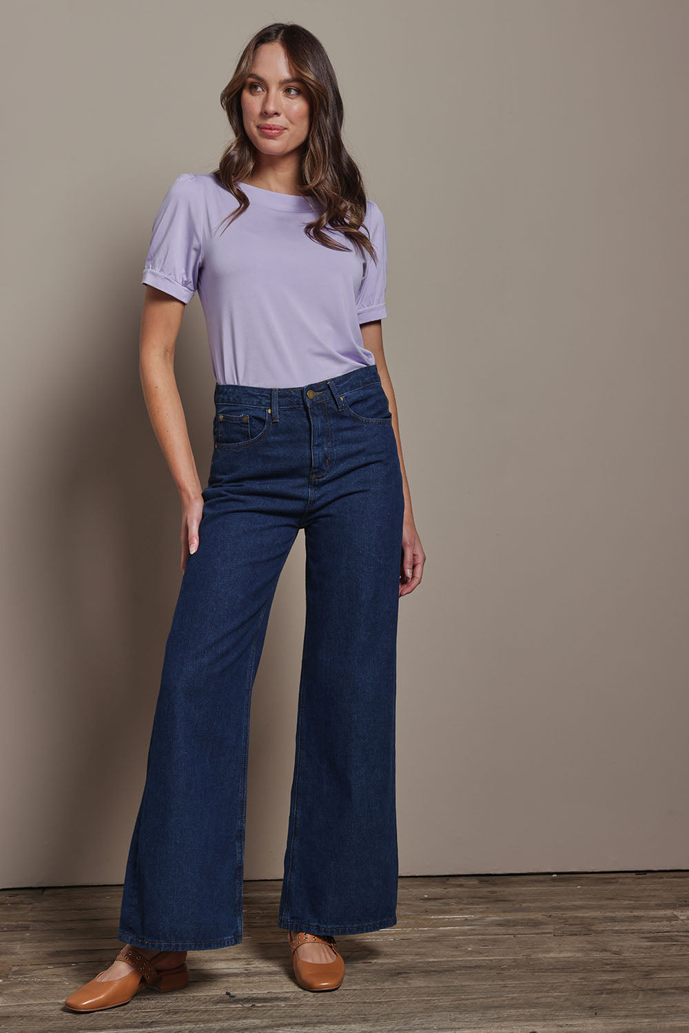 Model Madeline wearing size 10 of The Bamboo Boat Neck Short Sleeve Top in colour Lilac (Purple), from the front, showing the whole outfit