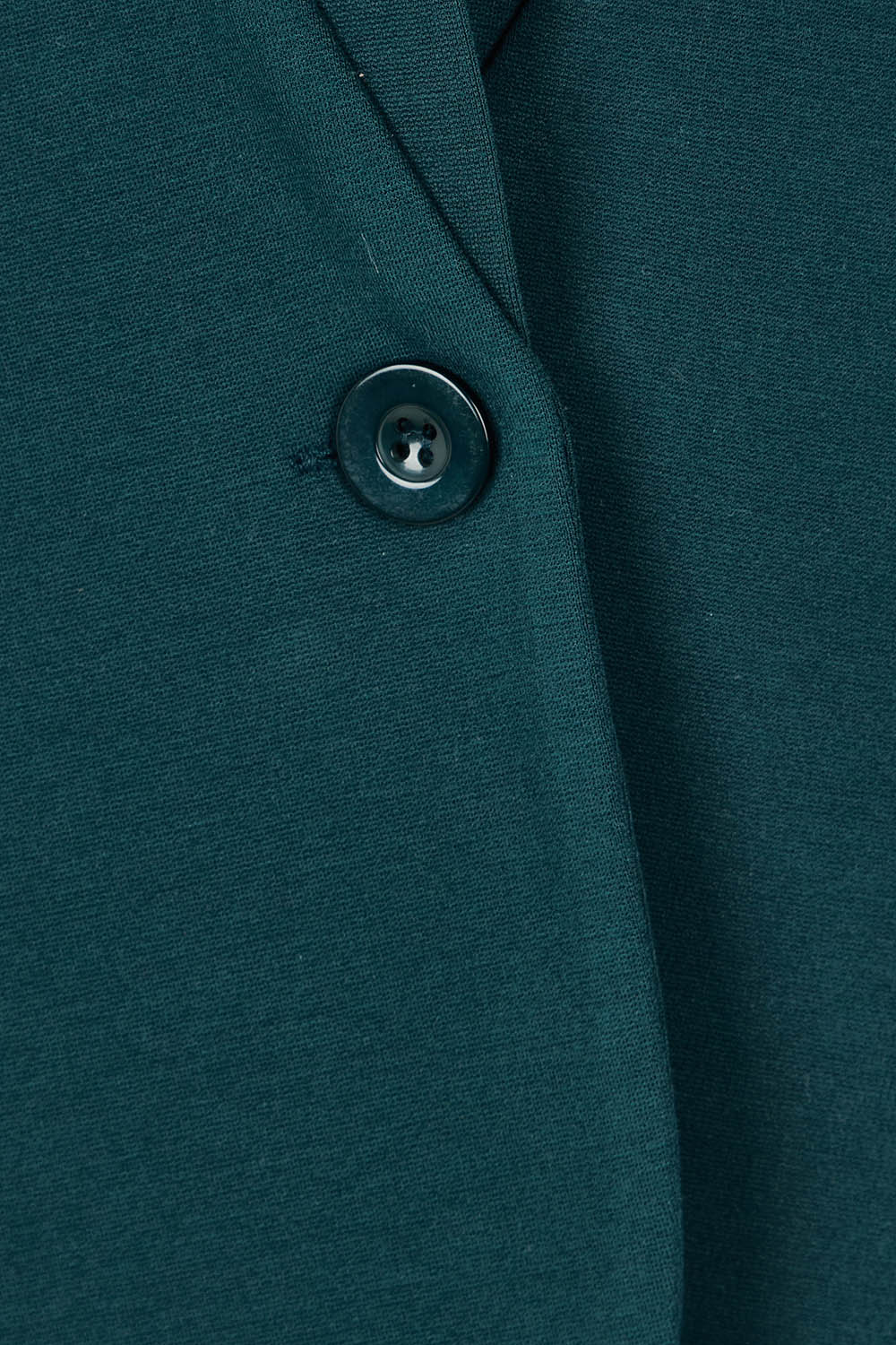 Product shot of The Reverse Lapel Ponte Blazer in colour Lagoon (Green), detail
