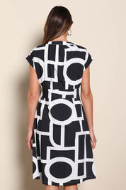 Model Madelinec wearing size 10 of the The Printed Cotton Blend Shirt Dress - Blackwhite in colour Blackwhite, from the back