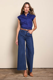 Model Madelinec wearing size 10 of the The Cap Sleeve Cotton Stretch Shirt - Indigoblue in colour Indigoblue, from the front
