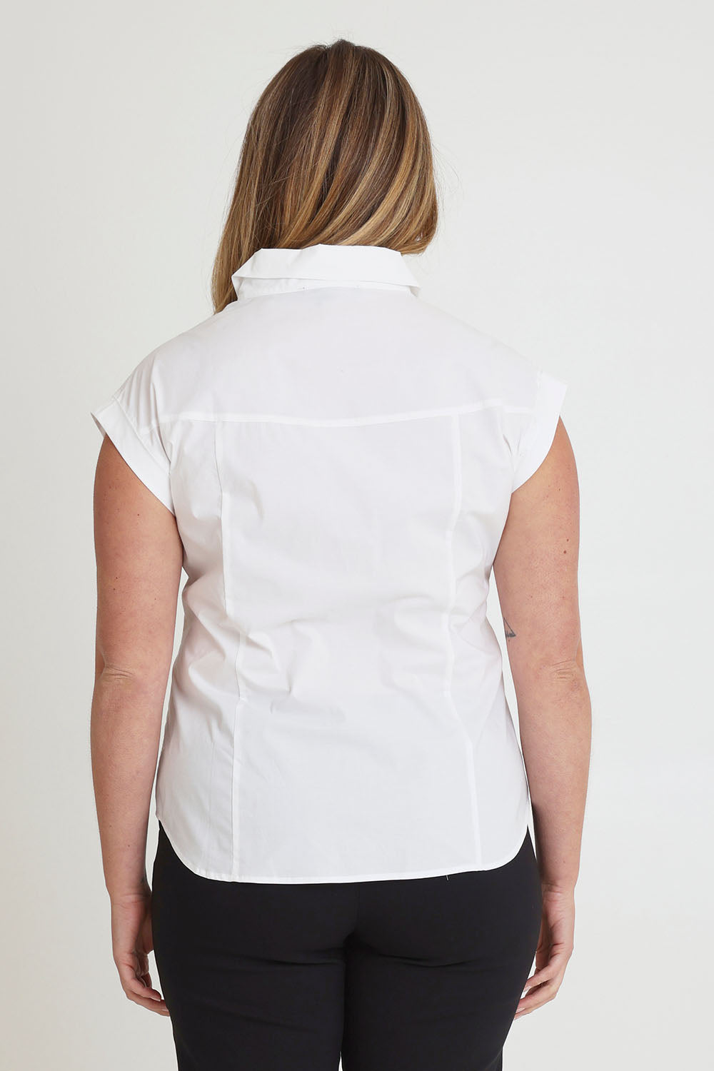 Model Chanel wearing size 16 of The Cap Sleeve Cotton Stretch Shirt in colour White (White), from the back