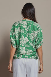 Model Amanda wearing size 10 of The Dolman Sleeve Button Up Shirt in colour Greenbloom (Green), from the back