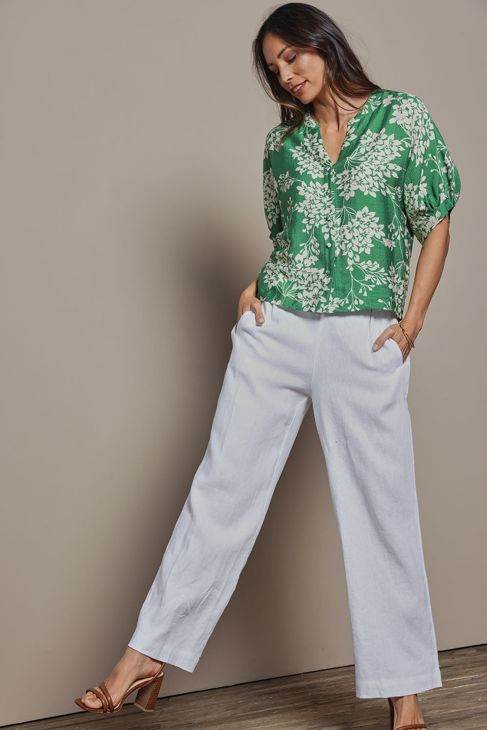 Model Amanda wearing size 10 of The Dolman Sleeve Button Up Shirt in colour Greenbloom (Green), from the front, showing the whole outfit