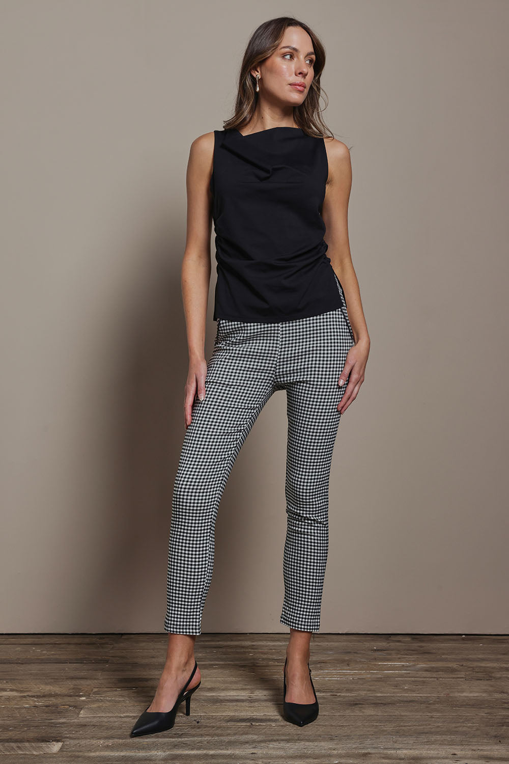 Model Madeline wearing size 10 of The Cotton Stretch Gingham Pull On Pant in colour Blackwhite (Black), from the front, showing the whole outfit