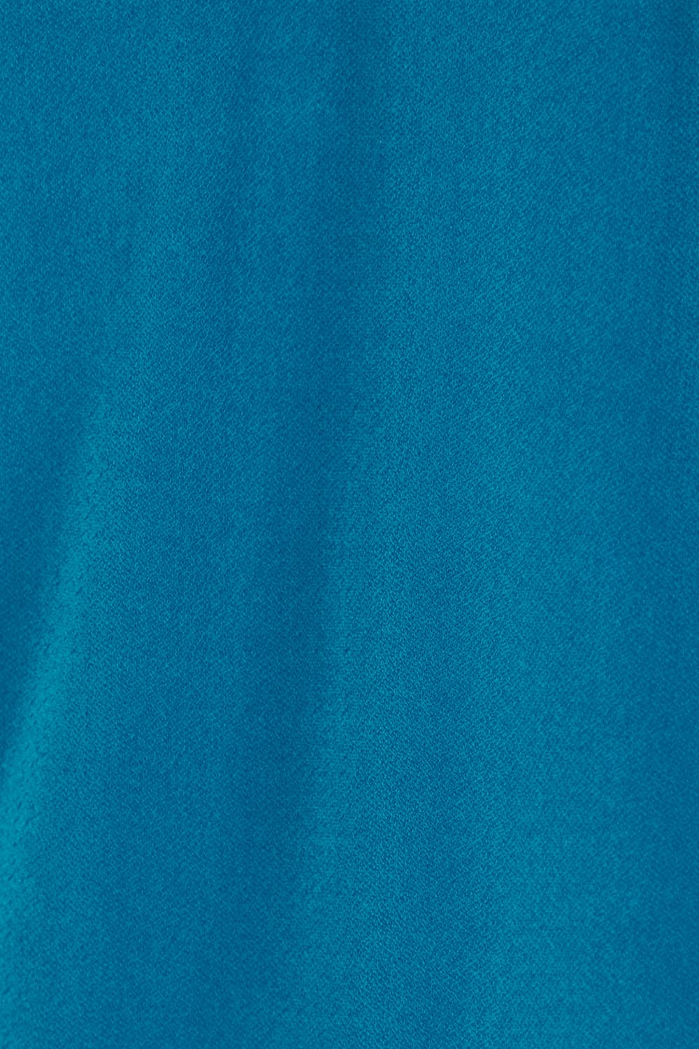 Product shot of The Sleeveless Crossover Top in colour Tealblue (Blue), detail